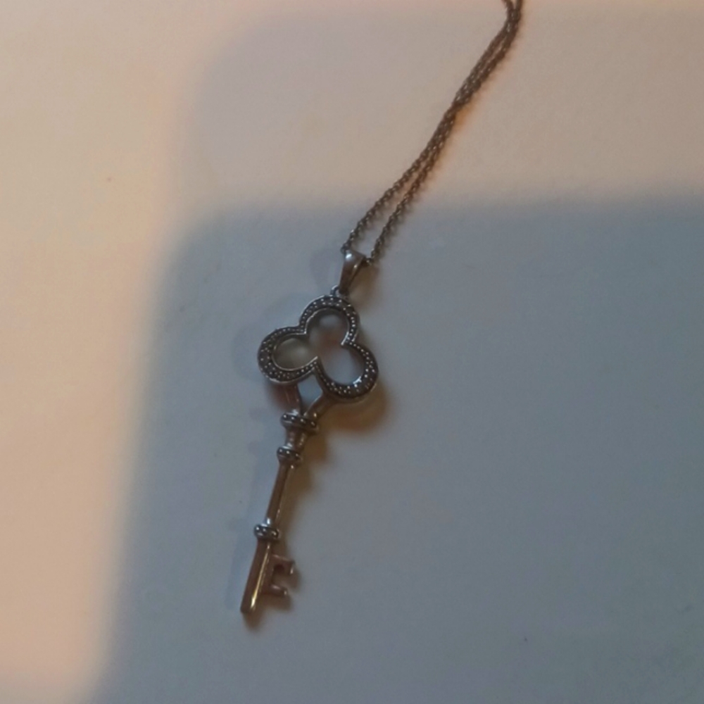 Sterling silver Key pendant with diamonds.